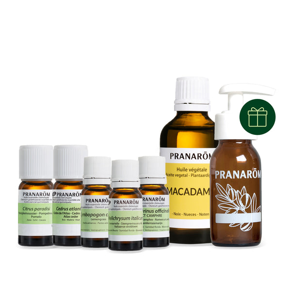 Lot d'huiles essentielles, huile végétale et flacon pour une recette anti-cellulite.