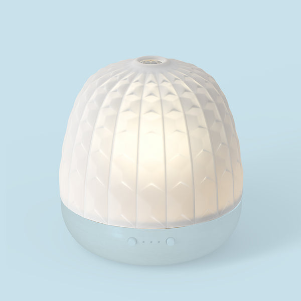 Diffuseur Cera Dôme Scala Pranarôm avec une lumière d'ambiance.